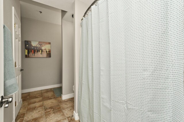 180 Grace Chapel Rd Unit 220, Blue Eye, MO 65611 - bathroom featuring stone finish flooring and a shower with curtain