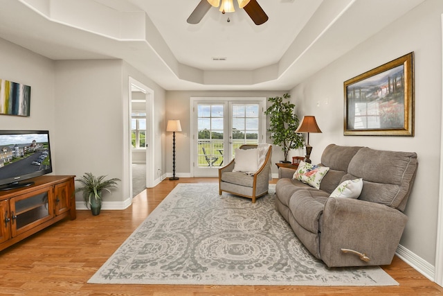 180 Grace Chapel Rd Unit 220, Blue Eye, MO 65611 - living room featuring light wood-style floors, a ceiling fan, and a raised ceiling