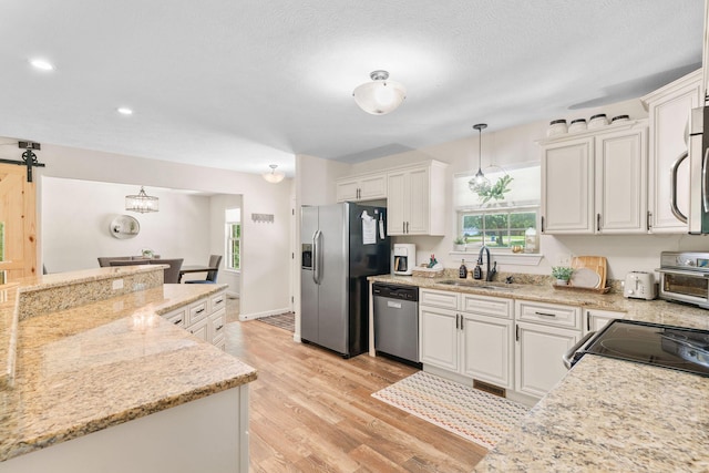 1865 Morningside Falls Blvd, Blue Eye, MO 65611 - kitchen featuring stainless steel appliances, white cabinets, healthy amount of natural light, and recessed lighting