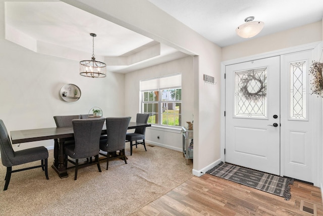 1865 Morningside Falls Blvd, Blue Eye, MO 65611 - foyer entrance with light wood-style floors, a chandelier, and a tray ceiling
