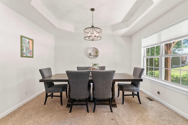 1865 Morningside Falls Blvd, Blue Eye, MO 65611 - dining space featuring a chandelier, light carpet, and a tray ceiling