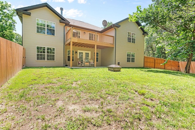 1865 Morningside Falls Blvd, Blue Eye, MO 65611 - rear view of property featuring french doors, a fenced backyard, and a patio