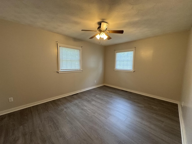 606 E Prairie Ln, Ash Grove, MO 65604 - spare room with a ceiling fan, a textured ceiling, and dark wood-type flooring
