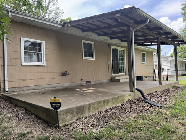 606 E Prairie Ln, Ash Grove, MO 65604 - rear view of house with crawl space and a patio