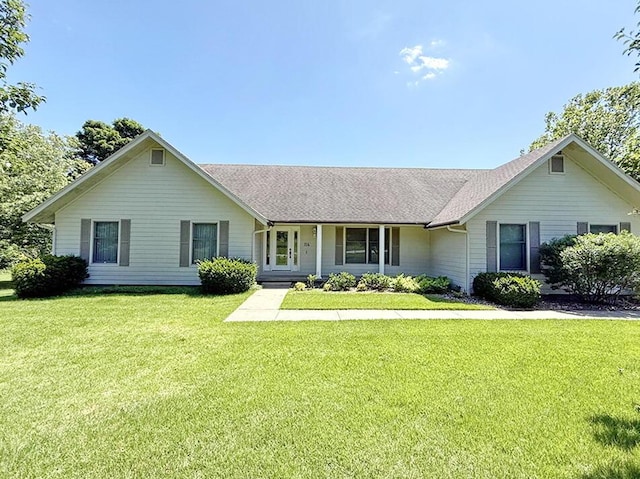114 W Carman Rd, El Dorado Springs, MO 64744 - ranch-style house featuring a front yard and roof with shingles