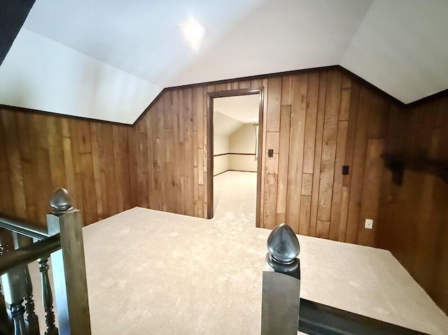 114 W Carman Rd, El Dorado Springs, MO 64744 - additional living space featuring wooden walls, vaulted ceiling, and carpet