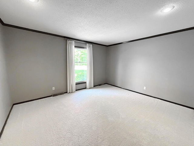 114 W Carman Rd, El Dorado Springs, MO 64744 - spare room featuring ornamental molding, a textured ceiling, and carpet flooring