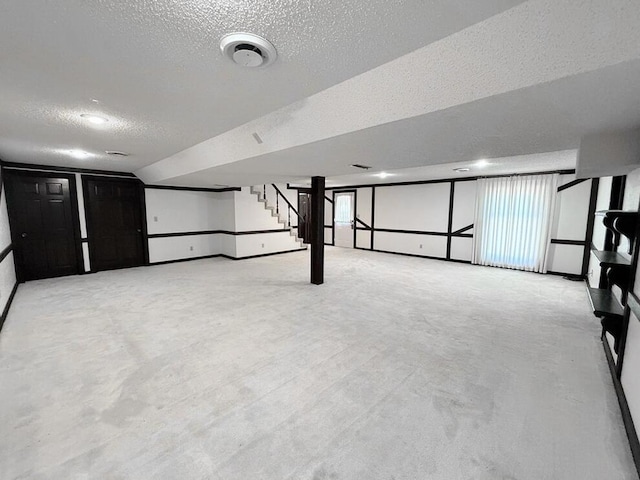 114 W Carman Rd, El Dorado Springs, MO 64744 - basement featuring stairway and a textured ceiling