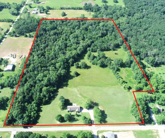 114 W Carman Rd, El Dorado Springs, MO 64744 - view of rural area with property parcel outlined and a heavily wooded area