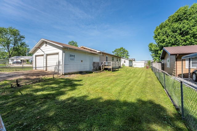 621 E Cleveland St, Seymour, MO 65746 - fenced backyard with a garage and driveway