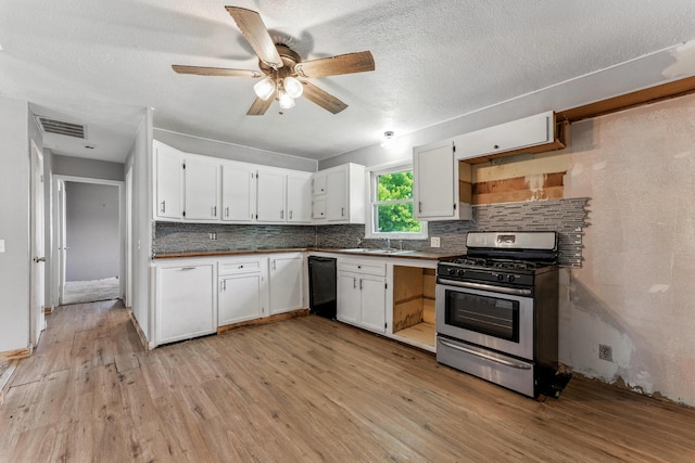 621 E Cleveland St, Seymour, MO 65746 - kitchen featuring stainless steel range with gas cooktop, dishwasher, tasteful backsplash, light wood finished floors, and white cabinets