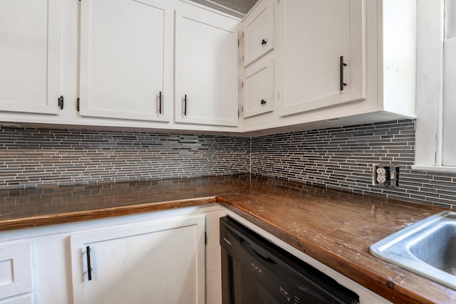 621 E Cleveland St, Seymour, MO 65746 - kitchen featuring dark countertops, white cabinets, dishwasher, and tasteful backsplash