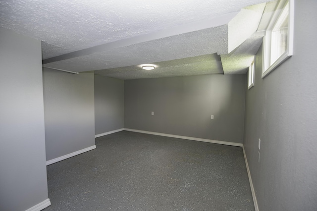 106 S 3rd Ave, Ozark, MO 65721 - basement featuring baseboards and a textured ceiling