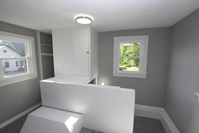 106 S 3rd Ave, Ozark, MO 65721 - bathroom with baseboards and a textured ceiling