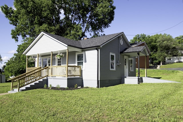 106 S 3rd Ave, Ozark, MO 65721 - view of front facade featuring a porch, a front yard, and roof with shingles