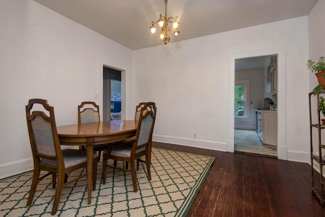 1510 E Mcdaniel St, Springfield, MO 65802 - dining room featuring dark wood-type flooring and a chandelier