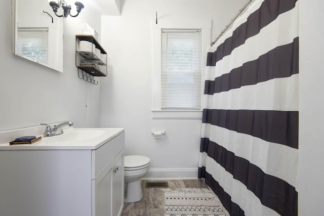 1510 E Mcdaniel St, Springfield, MO 65802 - full bathroom with vanity, curtained shower, and wood finished floors