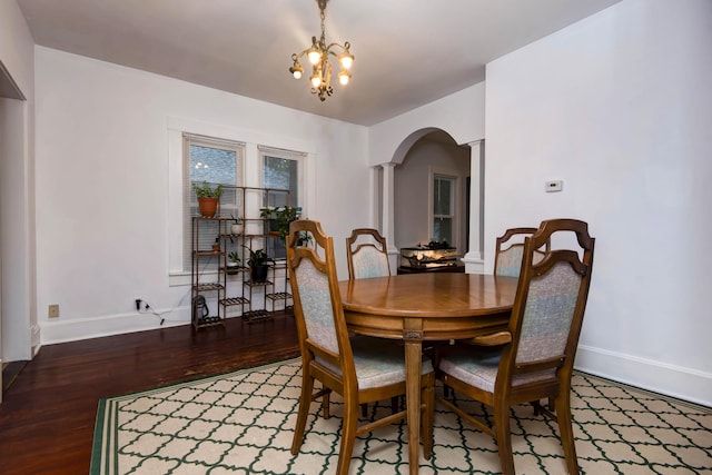 1510 E Mcdaniel St, Springfield, MO 65802 - dining space featuring arched walkways, wood finished floors, and a chandelier