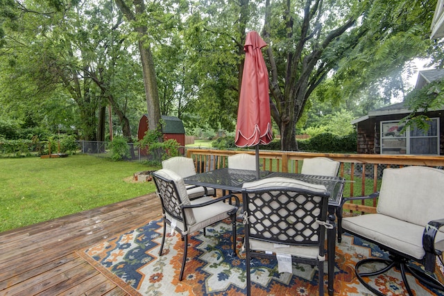 1510 E Mcdaniel St, Springfield, MO 65802 - wooden terrace featuring a storage shed, outdoor dining space, and view of wooded area