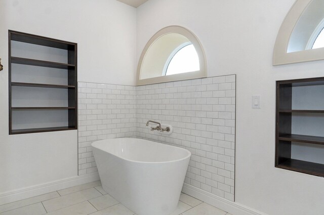 1115 S National Ave, Springfield, MO 65804 - bathroom with a soaking tub, healthy amount of natural light, tile walls, and tile patterned flooring
