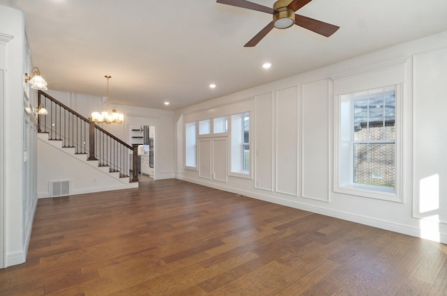 1115 S National Ave, Springfield, MO 65804 - foyer entrance with a chandelier, dark wood-style floors, stairway, a ceiling fan, and a decorative wall