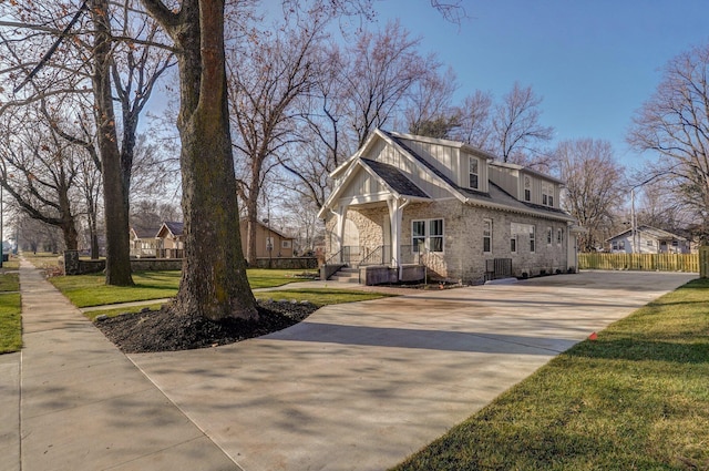 1115 S National Ave, Springfield, MO 65804 - view of property exterior featuring concrete driveway and brick siding