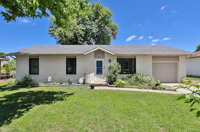 605 E Dyann Dr, Nixa, MO 65714 - ranch-style home with a garage, brick siding, a front lawn, and a shingled roof