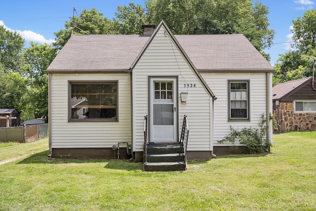 1524 S Thelma Ave, Springfield, MO 65807 - view of front of house featuring entry steps, a chimney, and a shingled roof
