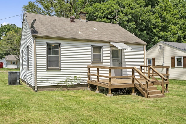 1524 S Thelma Ave, Springfield, MO 65807 - rear view of house with a wooden deck, a chimney, a lawn, and roof with shingles