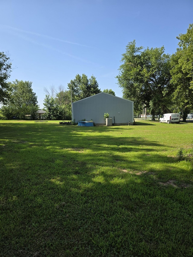206 Ada St, Greenfield, MO 65661 - view of green lawn with a pole building