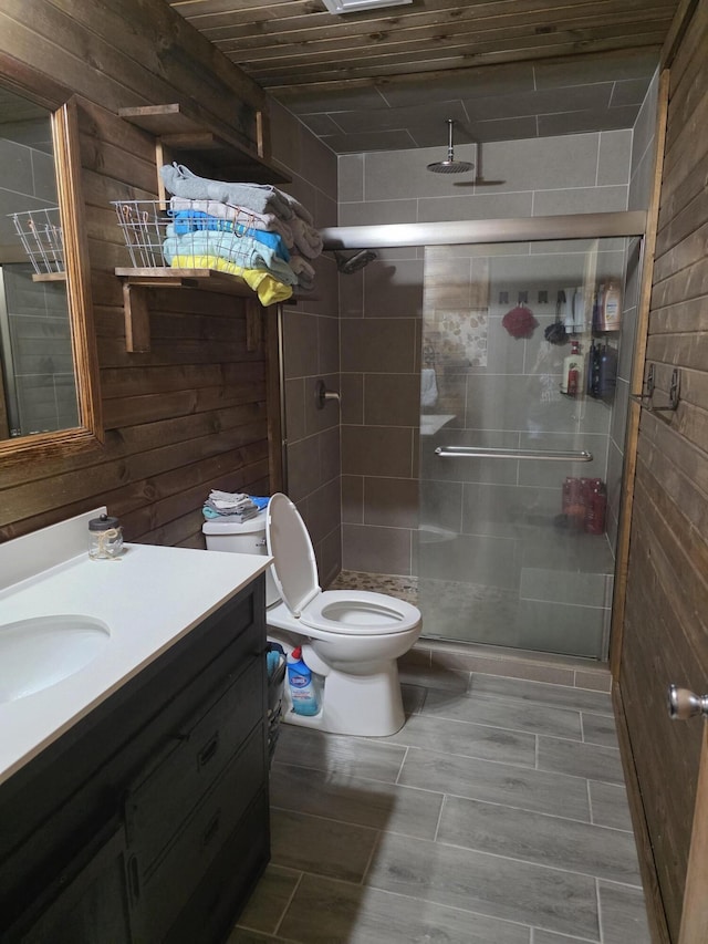 206 Ada St, Greenfield, MO 65661 - bathroom featuring vanity, a stall shower, and wooden walls