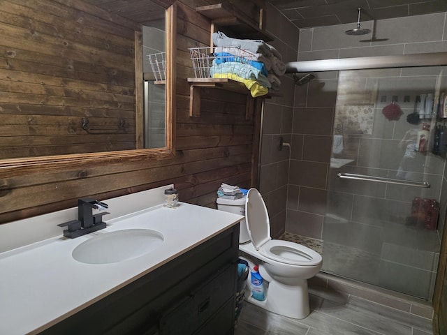 206 Ada St, Greenfield, MO 65661 - bathroom featuring wooden walls, vanity, and a shower stall