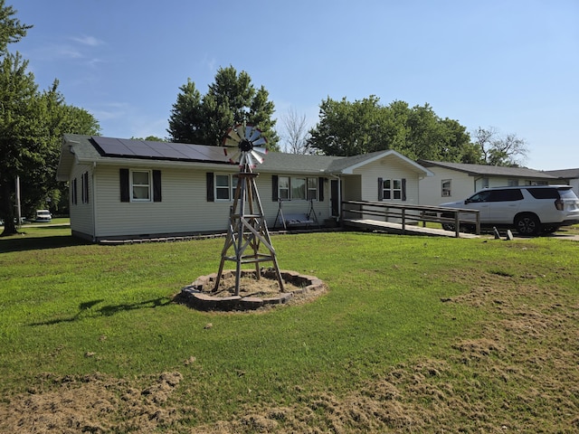 206 Ada St, Greenfield, MO 65661 - rear view of property with roof mounted solar panels and a yard