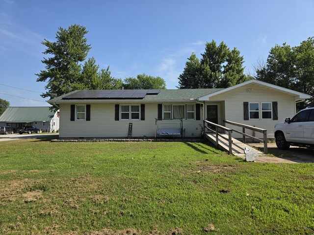 206 Ada St, Greenfield, MO 65661 - single story home featuring roof mounted solar panels and a front yard