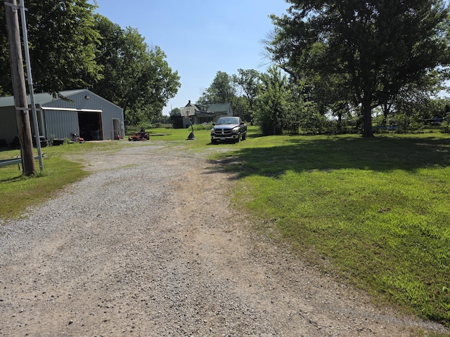 206 Ada St, Greenfield, MO 65661 - view of dirt / gravel road featuring a pole building