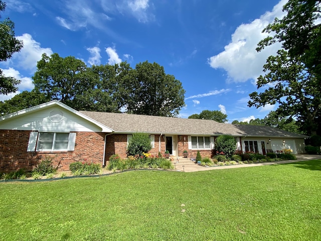 1605 S Park Ave, Aurora, MO 65605 - single story home featuring a front lawn, brick siding, and an attached garage