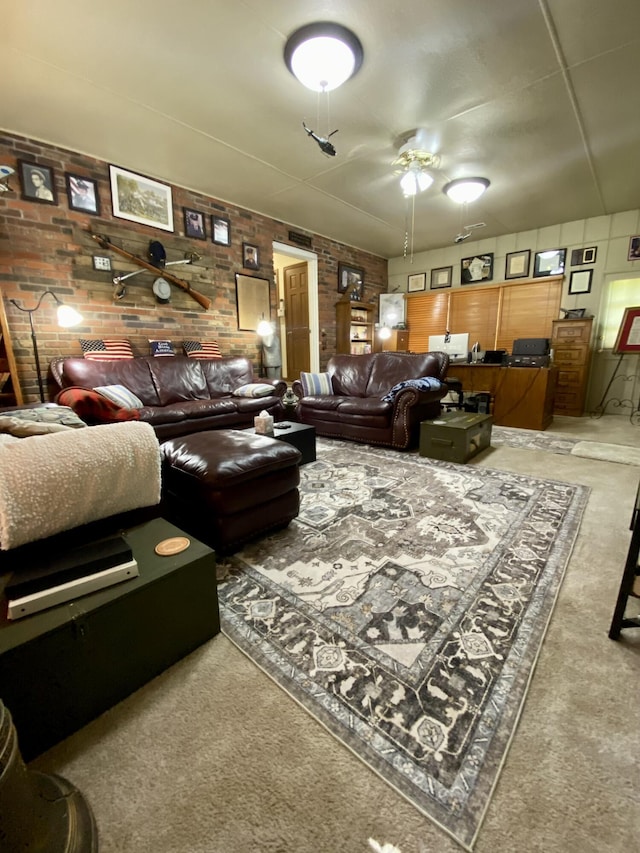 1605 S Park Ave, Aurora, MO 65605 - carpeted living area with a ceiling fan and brick wall