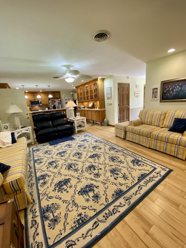 1605 S Park Ave, Aurora, MO 65605 - living area featuring light wood-style floors, a ceiling fan, and recessed lighting