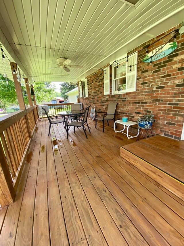 1605 S Park Ave, Aurora, MO 65605 - deck with a ceiling fan and outdoor dining space