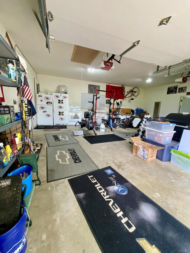 1605 S Park Ave, Aurora, MO 65605 - garage featuring a garage door opener and freestanding refrigerator
