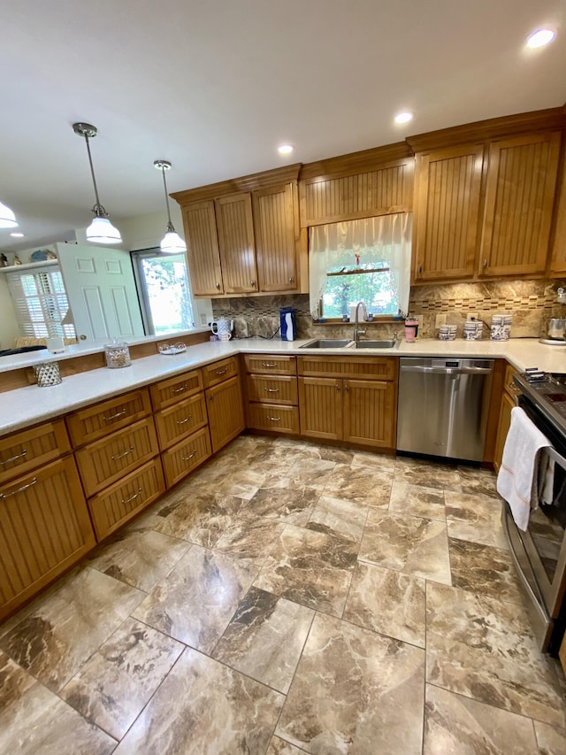 1605 S Park Ave, Aurora, MO 65605 - kitchen featuring stainless steel appliances, decorative backsplash, decorative light fixtures, light countertops, and recessed lighting