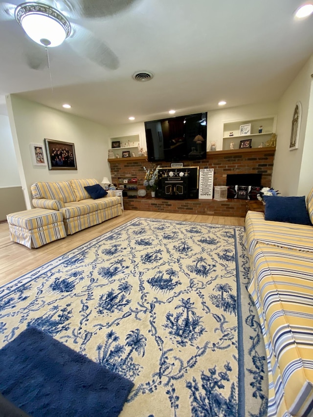 1605 S Park Ave, Aurora, MO 65605 - living room with a fireplace, wood finished floors, and recessed lighting