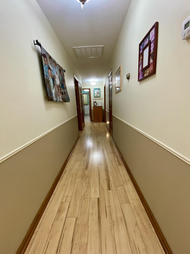 1605 S Park Ave, Aurora, MO 65605 - corridor featuring light wood-style flooring and attic access
