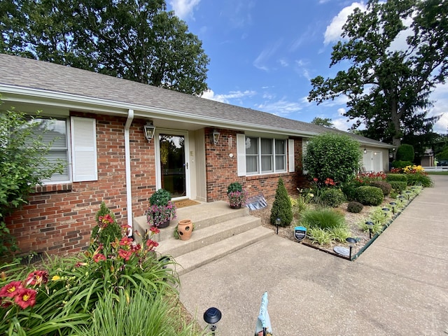 1605 S Park Ave, Aurora, MO 65605 - entrance to property featuring brick siding and a shingled roof