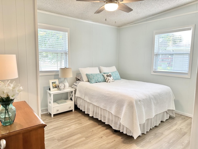 25795 Canyon Dr, Hermitage, MO 65668 - bedroom with a textured ceiling, ornamental molding, multiple windows, light wood finished floors, and ceiling fan