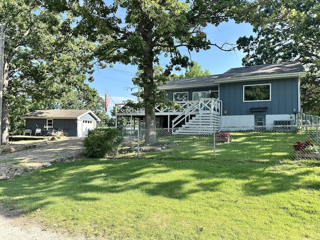 25795 Canyon Dr, Hermitage, MO 65668 - view of yard with a garage, a deck, an outdoor structure, gravel driveway, and stairs