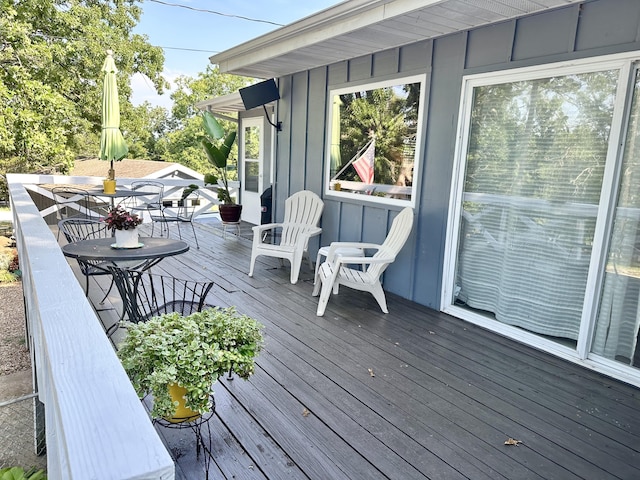 25795 Canyon Dr, Hermitage, MO 65668 - wooden terrace with outdoor dining space