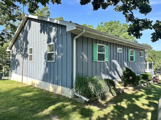 25795 Canyon Dr, Hermitage, MO 65668 - view of side of property featuring board and batten siding and a yard