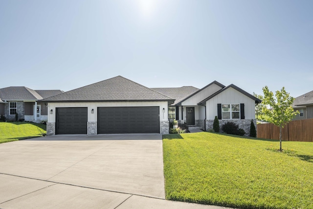 840 S Eastridge Ave, Nixa, MO 65714 - view of front of house featuring an attached garage, concrete driveway, stone siding, and board and batten siding