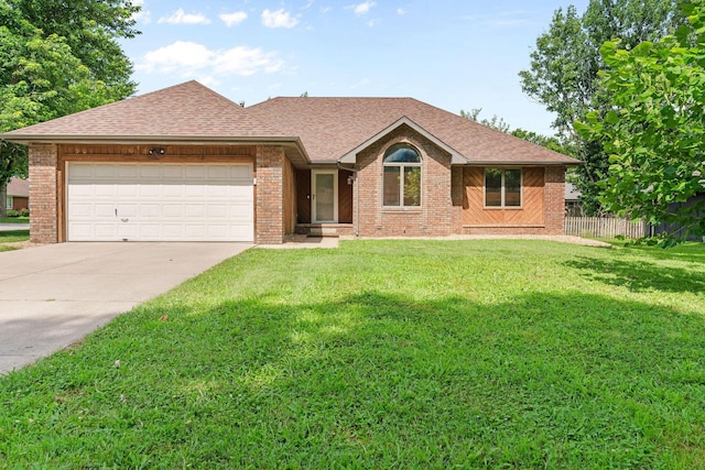 901 Fort Ct, Nixa, MO 65714 - single story home with brick siding, concrete driveway, roof with shingles, and an attached garage